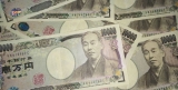 Japan Holds Record Low Interest Rates, Yen Falls