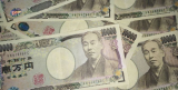 Japan Holds Record Low Interest Rates, Yen Falls